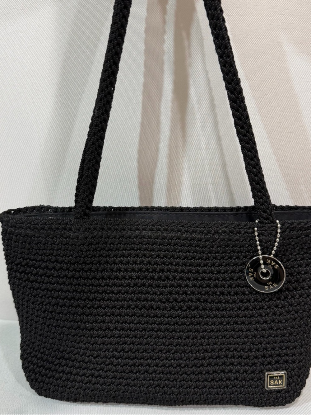 The Sak Crochet hand Bag Black Small 2 Strap Handles Zip Purse Charm Logo 6x8”